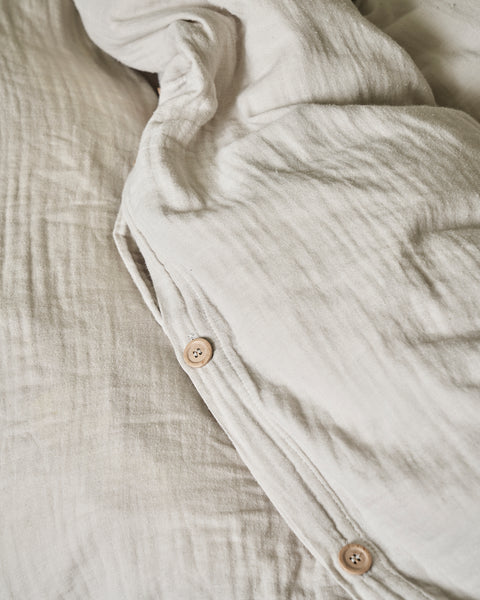 light grey organic cotton gauze bed linen with buttons