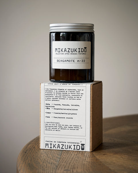 Mikazukido candle -Bergamot no 22 with packaging on a wooden surface